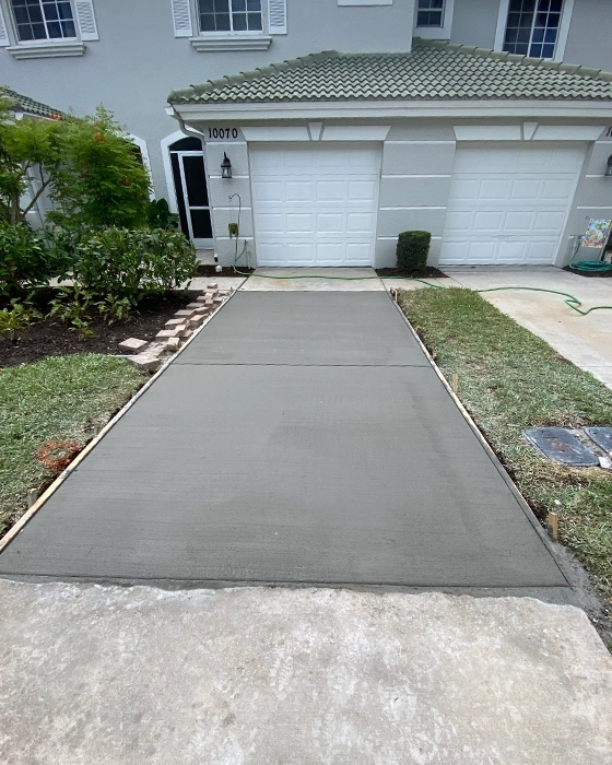 Concrete driveway installation with smooth finish