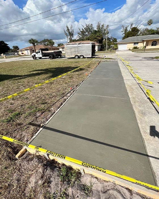 Concrete driveway installation with smooth finish