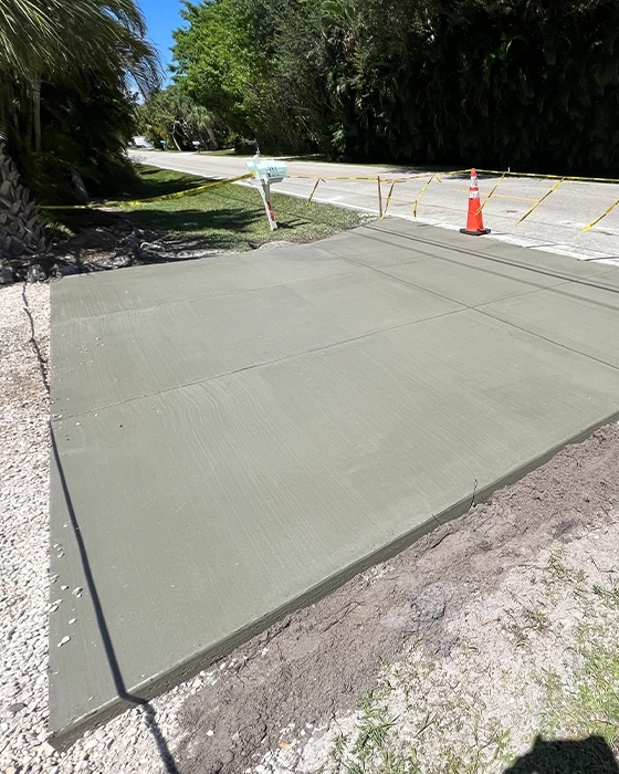 Concrete driveway installation with smooth finish
