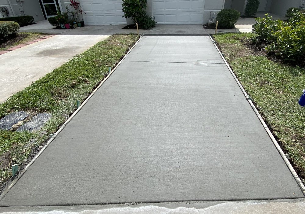 Concrete driveway installation with smooth finish