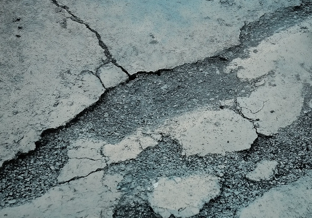 Spalling concrete showing surface deterioration
